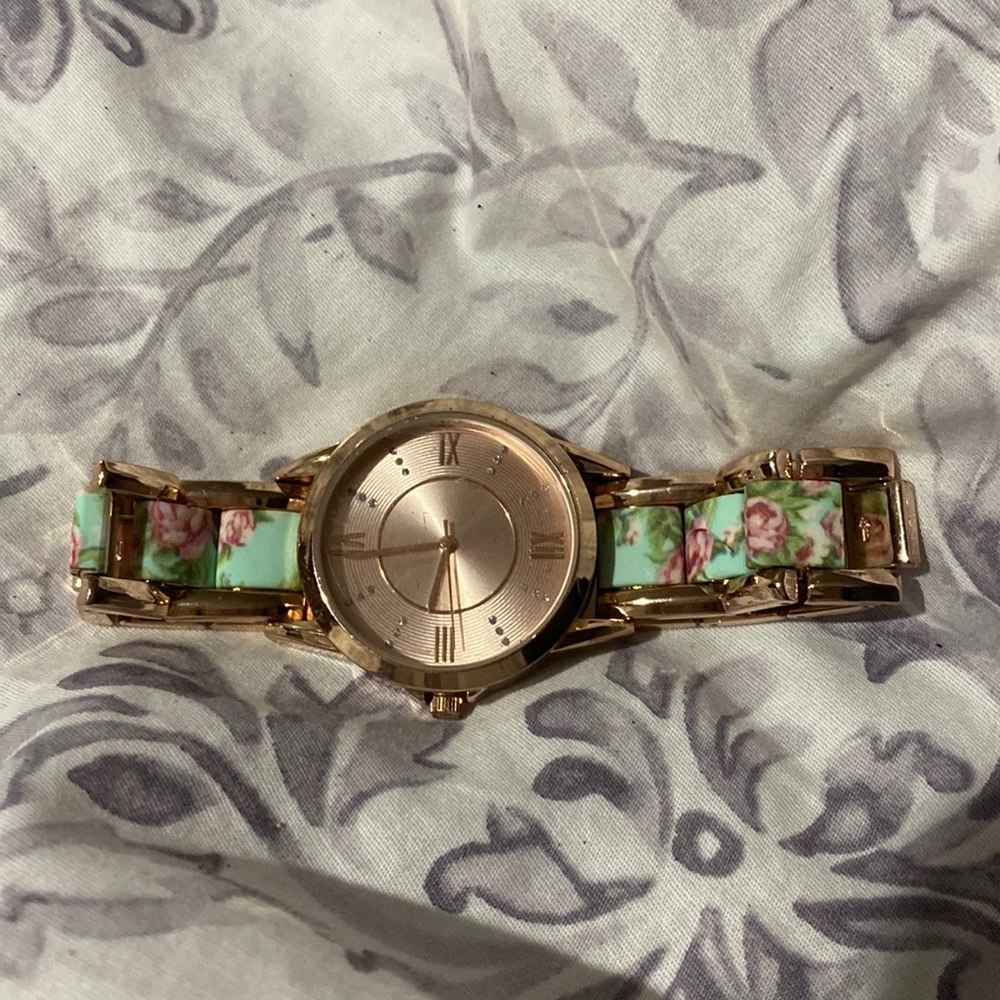 Rose gold watch with floral design